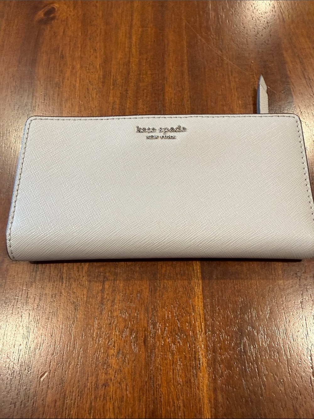 kate spade gray saffiano zip wallet with gold logo